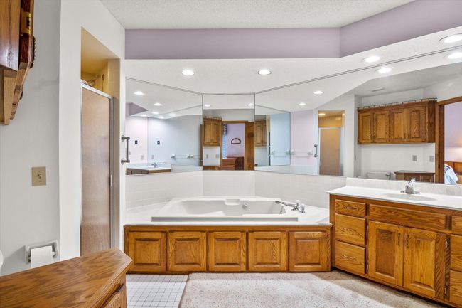 Large bath with soaking tub and separate shower. | Image 16