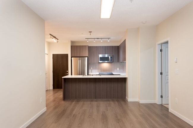 102 - 1152 Windsor Mews, Condo with 3 bedrooms, 2 bathrooms and 2 parking in Coquitlam BC | Image 15