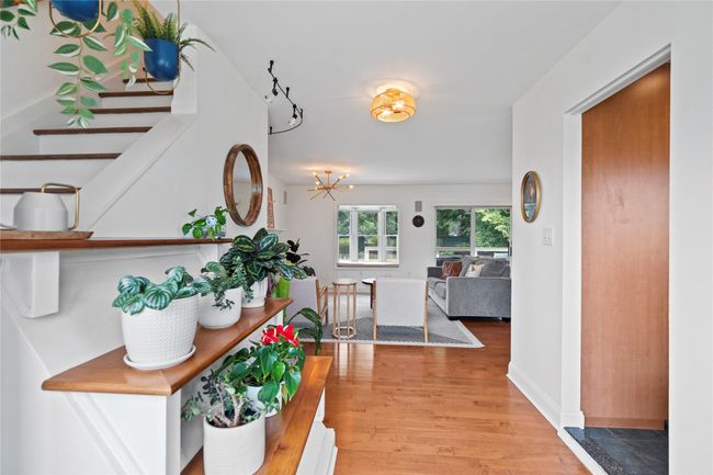 Hall featuring light wood-style floors and stairway | Image 4