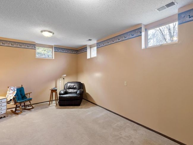 The 18x12 flex room at the rear of the home doesn’t include a legal egress window, but it’s an ideal spot for a home-based business or creative space. | Image 31