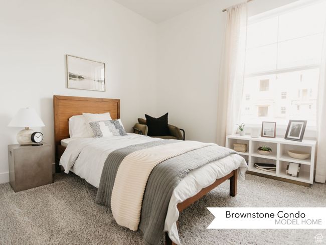 Bedroom featuring light carpet | Image 13