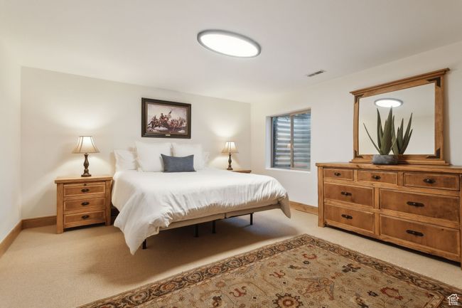 Bedroom with light colored carpet and baseboards | Image 55