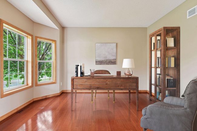 Main level office space off front of home flooded with natural light | Image 8