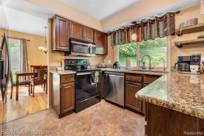 9003 Spencer Court, Home with 4 bedrooms, 2 bathrooms and null parking in Brighton MI | Image 2