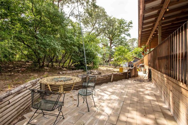 Wooden terrace with a patio area | Image 27