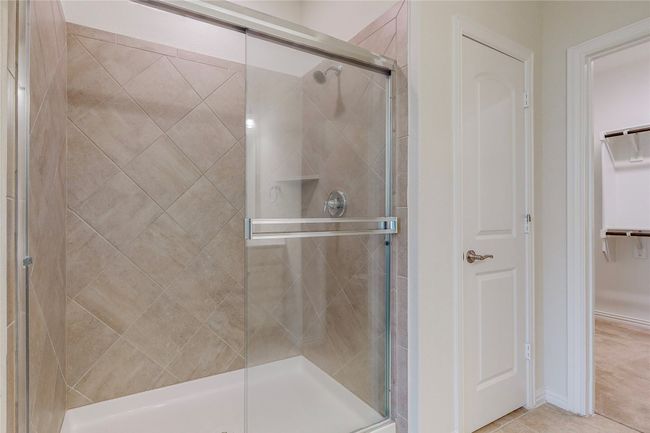 Full bathroom with a shower stall and a spacious closet | Image 23