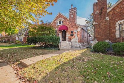 Lovely St. Louis Hills charmer, close to parks, grocery, restaurants and shopping. Brick and Stone elevation with a large front porch, beautiful new awnings just installed. | Image 1