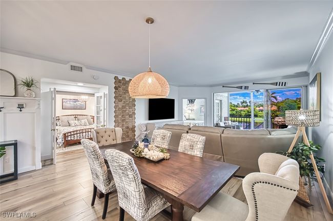 Dining room featuring light wood-style flooring and ornamental molding | Image 17