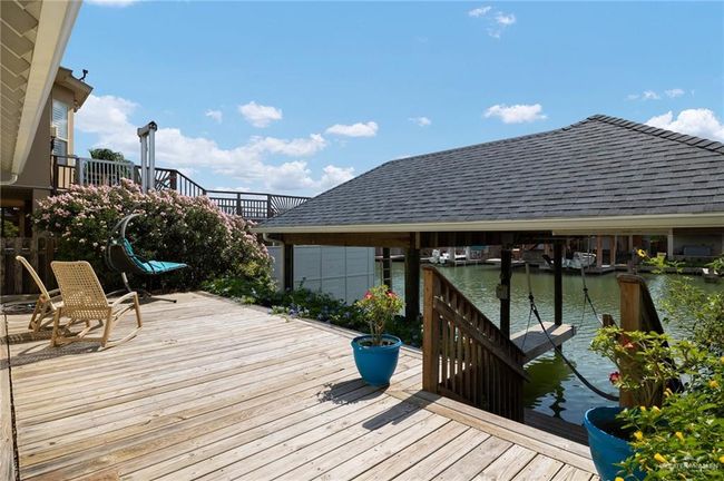 Wooden terrace featuring a water view | Image 18