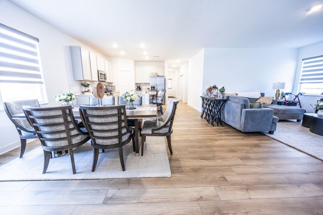dining area featuring light wood finished floors and recessed lighting | Image 6