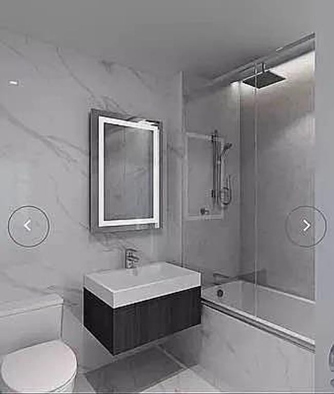 Bathroom featuring bathtub / shower combination, vanity, and toilet | Image 24