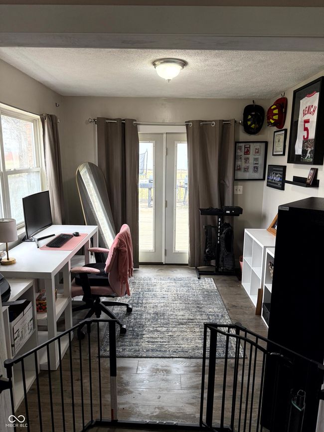 office area with a textured ceiling and wood finished floors | Image 26