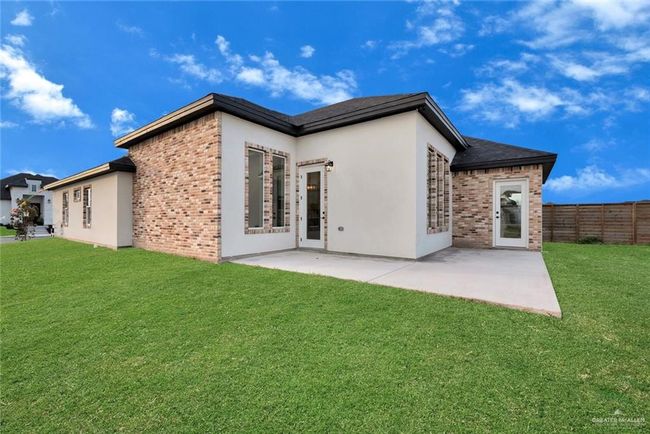 Rear view of property with a patio, brick siding, and stucco siding | Image 20