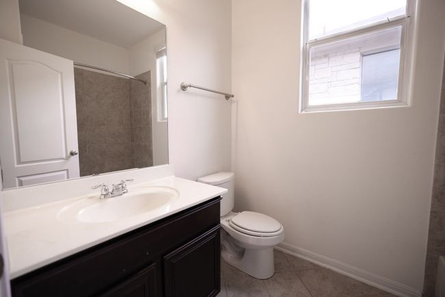 The full secondary bathroom comes with a shower/tub combo and a single vanity. | Image 16