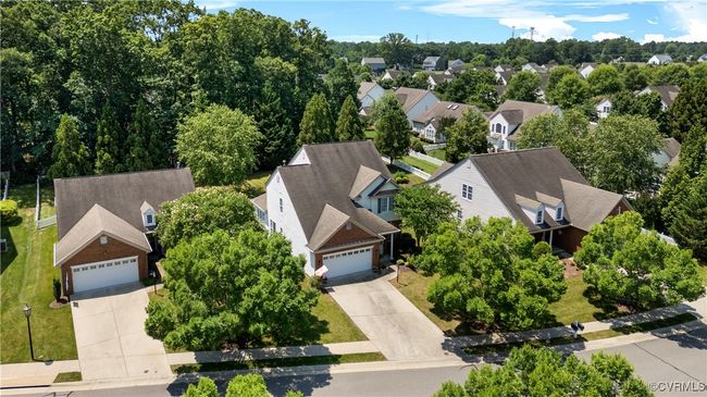 Aerial view of residential area with a tree filled landscape | Image 43