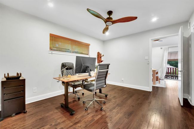 Office space featuring a ceiling fan, wood finished floors, and recessed lighting | Image 12