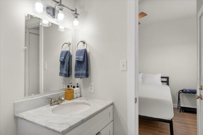 Bathroom with vanity and wood finished floors | Image 25