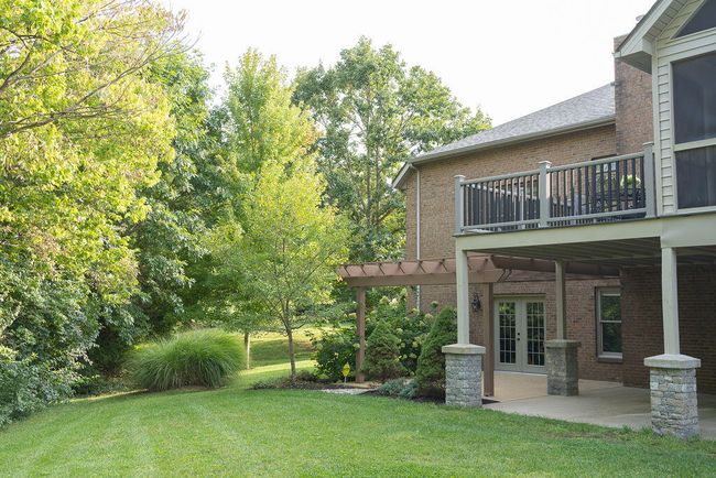 Back of ranch with full finished basement. Concrete patio. | Image 6