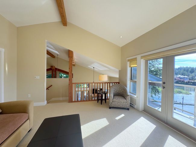Sitting room featuring carpet flooring, healthy amount of natural light, and french doors | Image 29