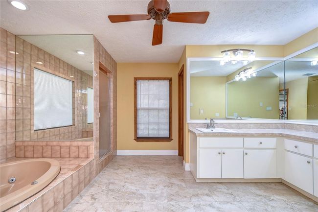 Family room with high vaulted celing and brick fireplace | Image 39