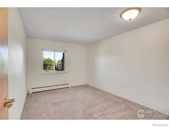 Large secondary bedroom with ample closet space | Image 20