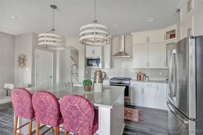 Imagine creating culinary masterpieces in this beautiful kitchen! HOME IS UNDER CONSTRUCTION - Photo is from builder's library and shown as an example only (colors, features and options will vary). | Image 1