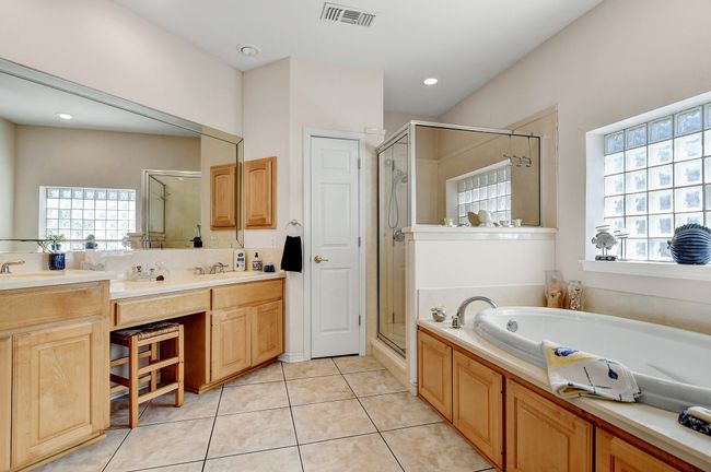 Primary ensuite bath with vanity, separate shower, soaking tub and huge walk in closet | Image 9
