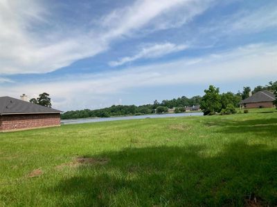 View of yard featuring a water view | Image 1