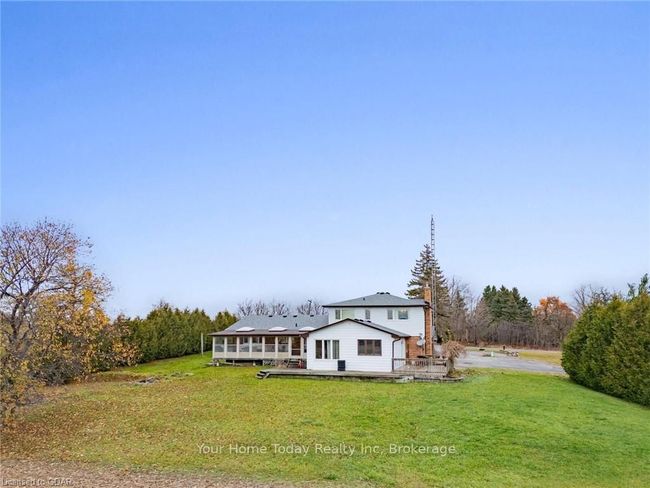 View of front of house with a front yard and a wooden deck | Image 38