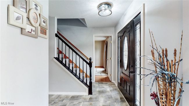 FOYER WITH NEUTRAL PAINT & CERAMIC TILE FLOOR. | Image 5