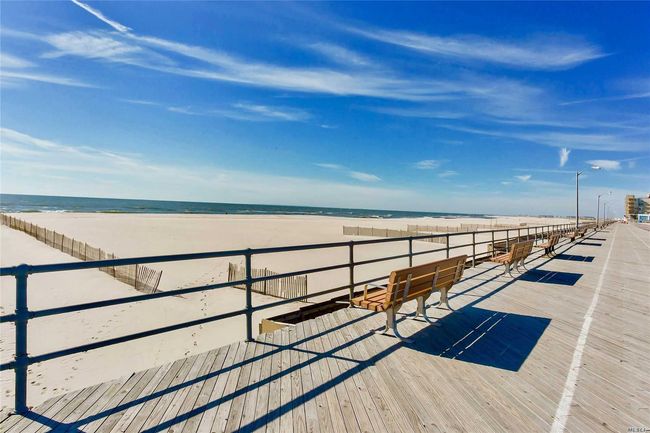 View of dock with a water view and a view of the beach | Image 30