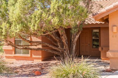 Lovely contemporary SW look with tile roof & stucco siding... | Image 3