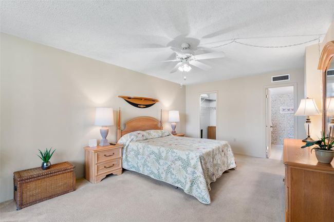 PRIMARY BEDROOM. VIEW TOWARDS WALK-IN CLOSET & ENSUITE BATH | Image 25