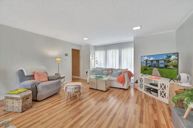 You can have a multitude of different furniture arrangements in this large family room. If you're one that likes to entertain, you'll love all of the space for get togethers and conversation. | Image 9