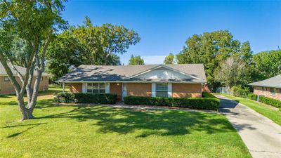 Ranch-style home with a front lawn | Image 1