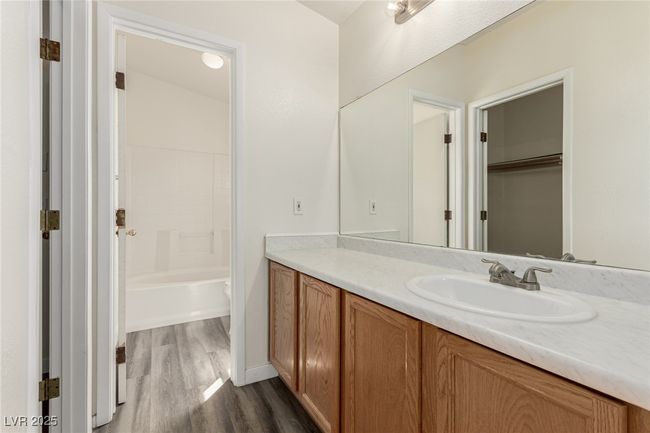 Full bath featuring wood finished floors and vanity | Image 14