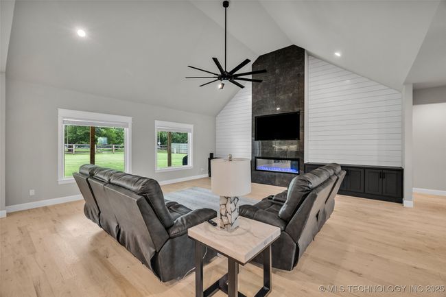 Living room with windows overlooking backyard | Image 13