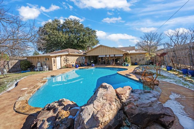 View of pool with a patio | Image 36