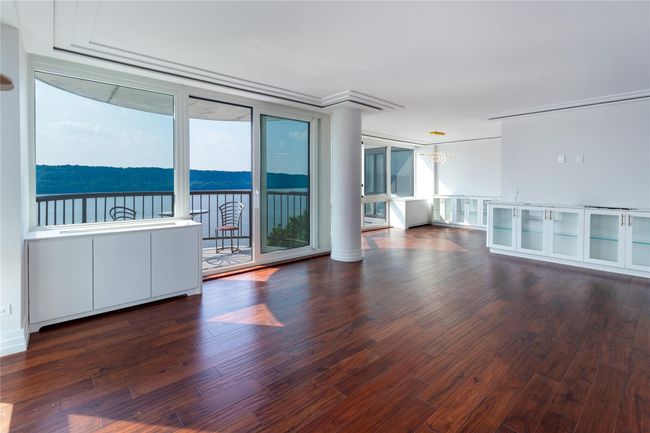 Spare room featuring wood finished floors | Image 7