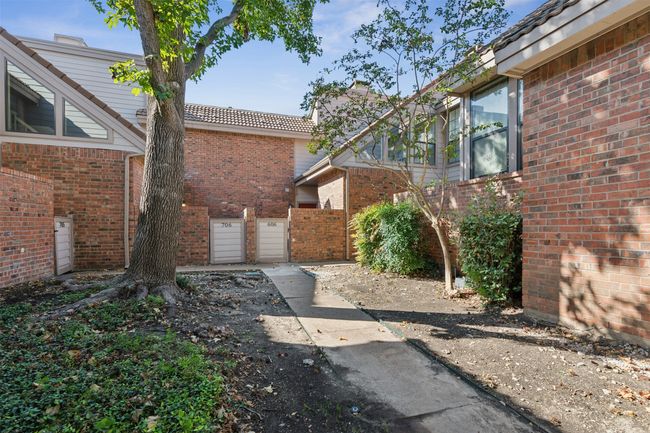 View of yard with a garage and a gate | Image 25