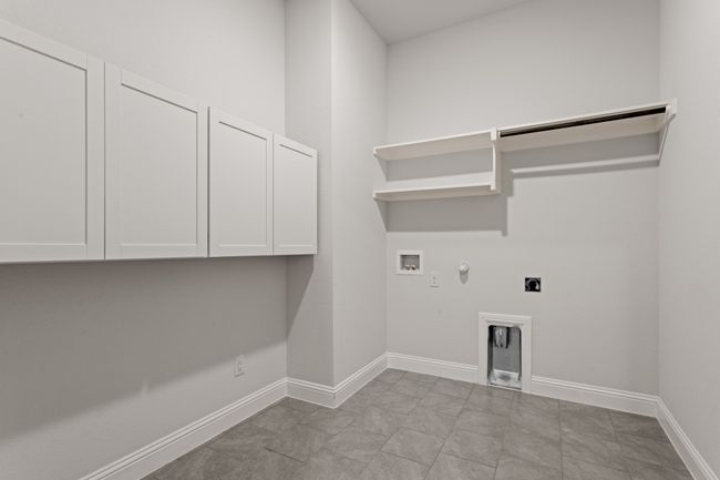 Laundry room with added cabinetry | Image 24
