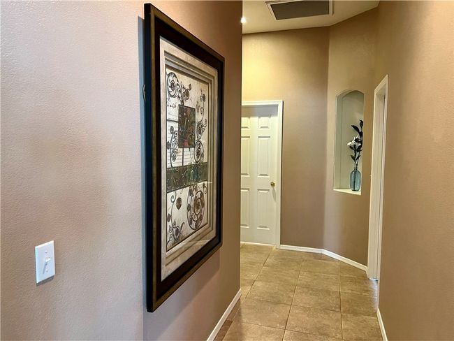 Hall featuring baseboards and light tile patterned floors | Image 30
