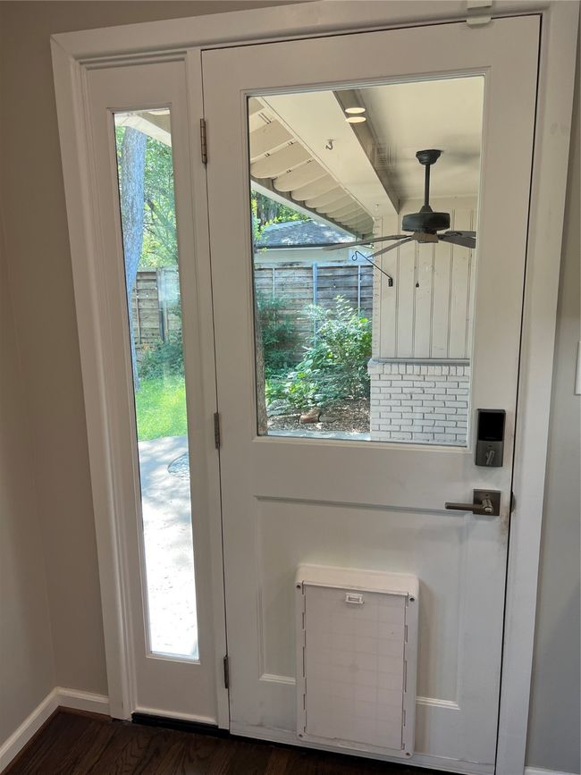 Doorway to outside with plenty of natural light and wood finished floors | Image 13