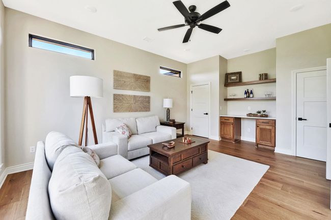 Living room featuring ceiling fan and light wood-type flooring | Image 19