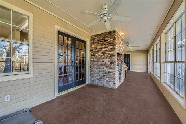There are 2 sets of double doors out to the sunroom (and pizza oven) with a wall of windows overlooking your | Image 25