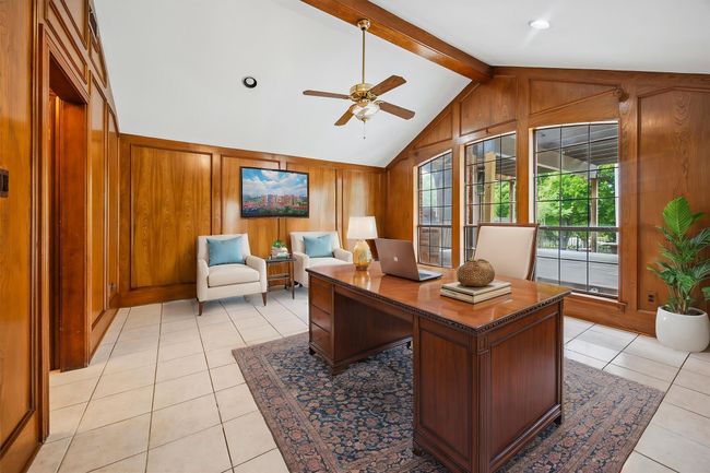 This virtually staged second living area downstairs could easily be used as a home office. | Image 22