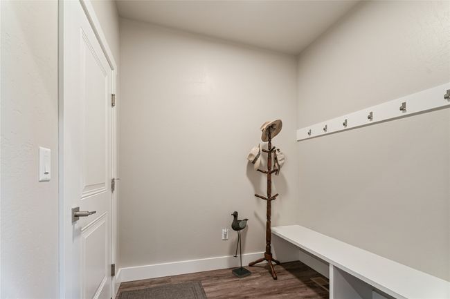 Mudroom with dark wood-style floors and baseboards | Image 25