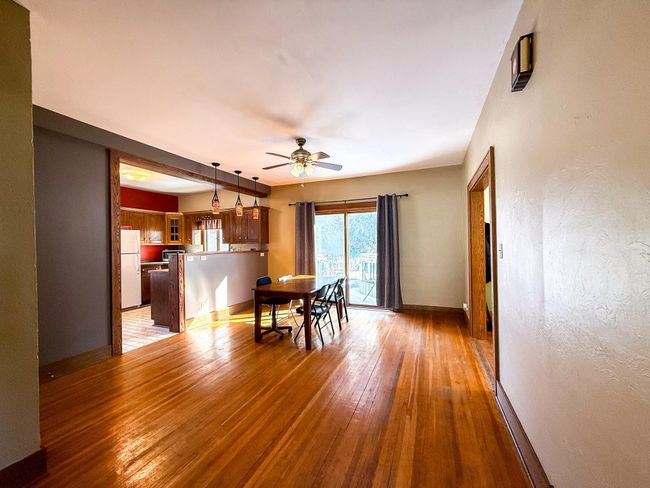 Sliding glass door off of the kitchen leads to a deck and patio for even more functionable space | Image 11