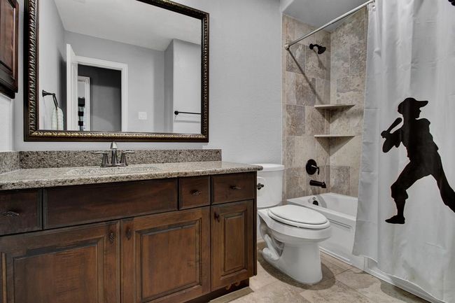 Secondary bath that is shared by the game room and 2 bedrooms. | Image 31