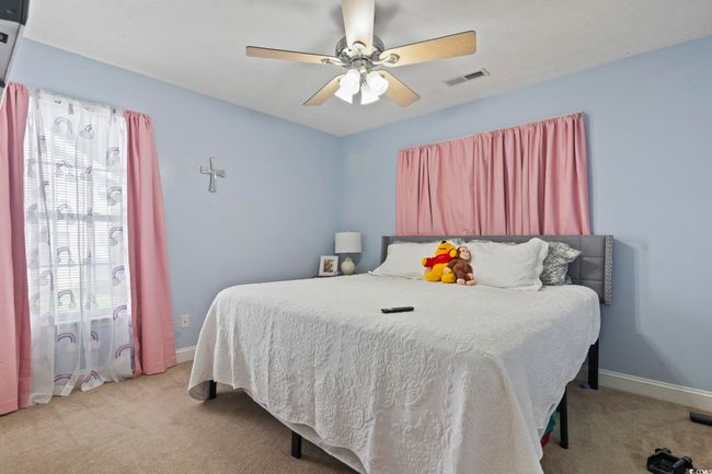 Bedroom featuring carpet floors and a ceiling fan | Image 24